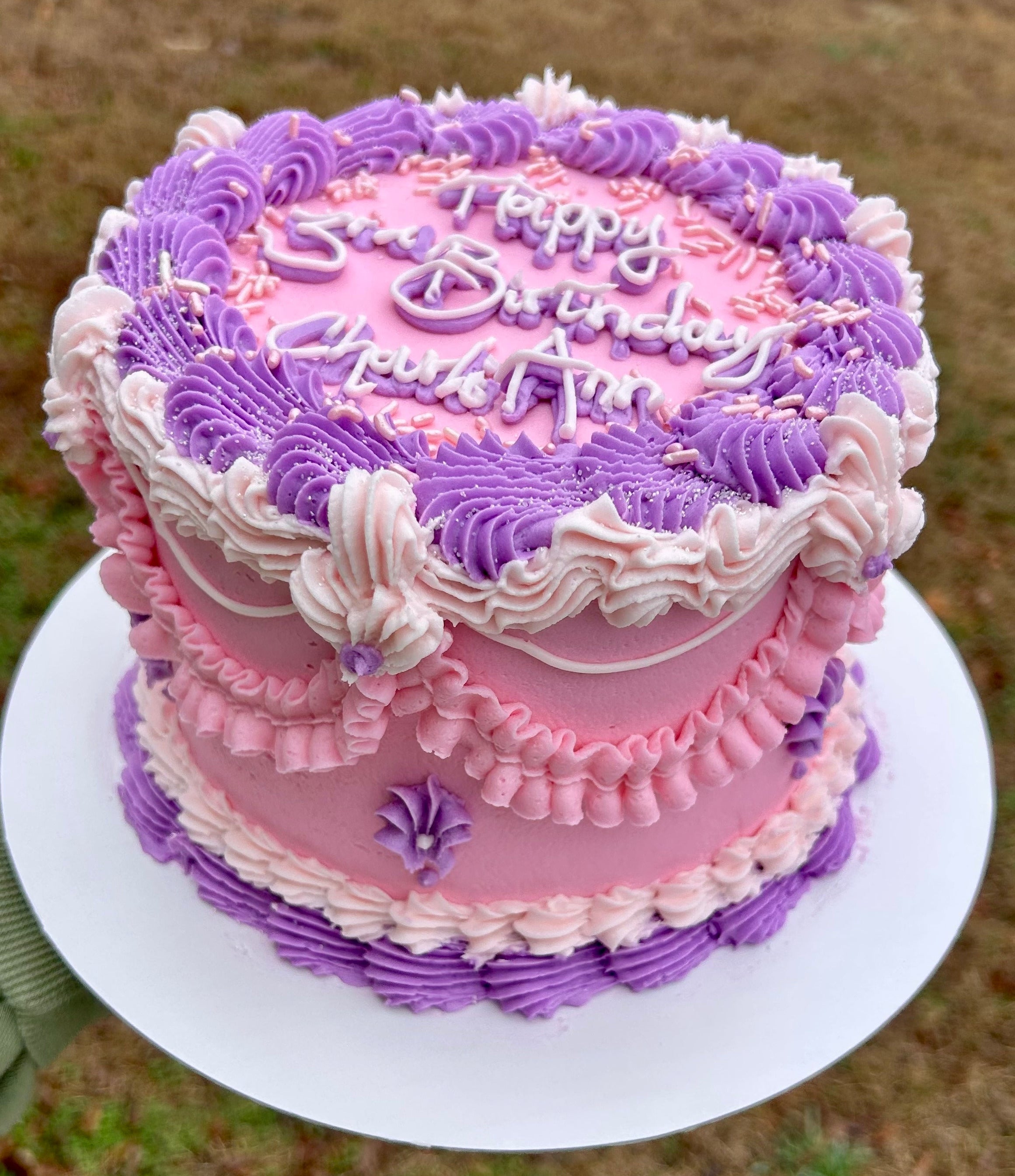 Pink and purple birthday cake with vintage piping and 'Happy 3rd Birthday Charli Ann' text