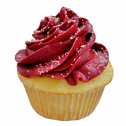 Maroon cupcake with swirled frosting and white sprinkles.
