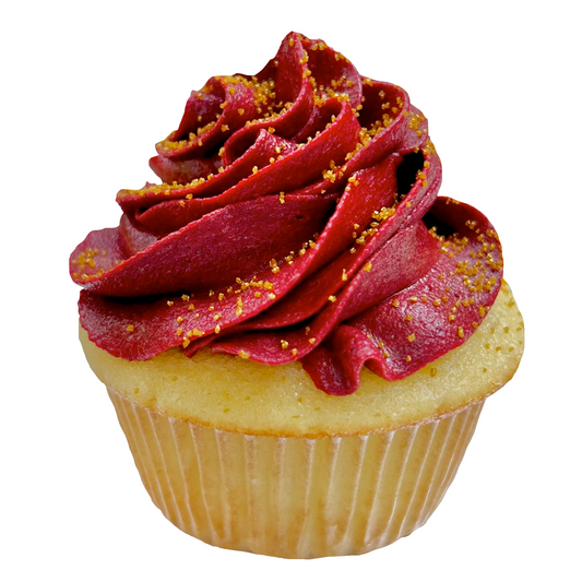 Maroon cupcake with swirled frosting and gold sprinkles.