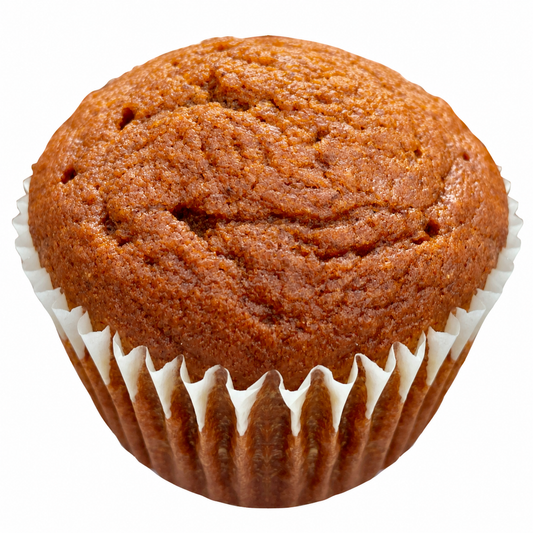 Pumpkin muffin with golden brown top in a paper liner.